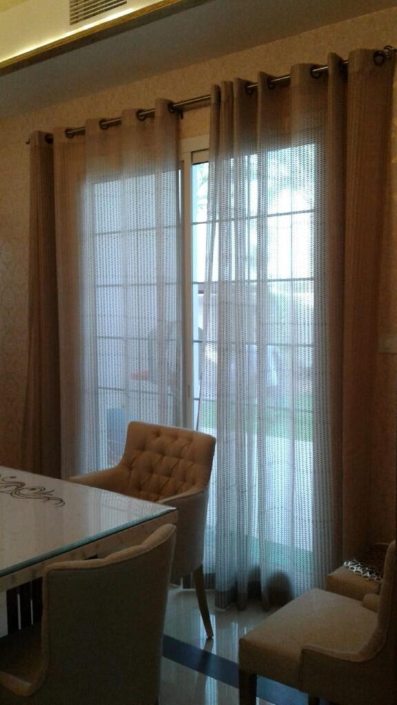 Sheer curtain installation in a Dubai villa