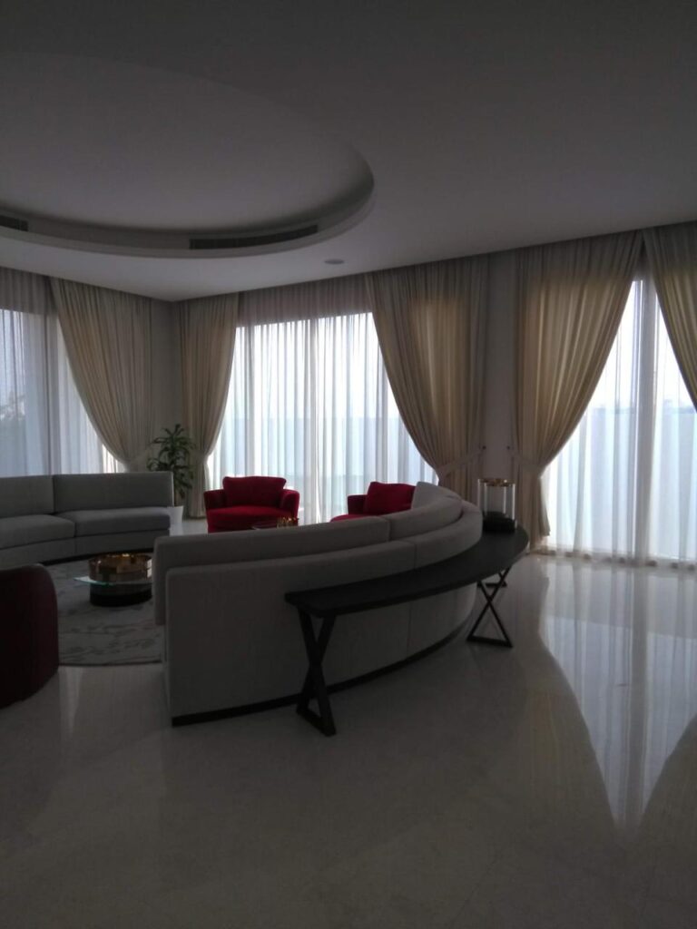 Home Layered curtains in a Dubai living room