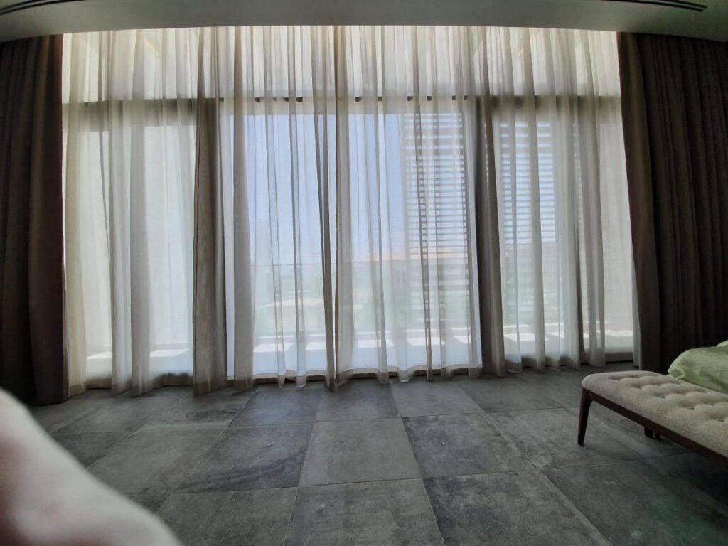 Curtain installation in a Dubai home