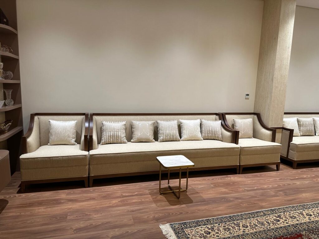 Long upholstered banquette seating with cushions