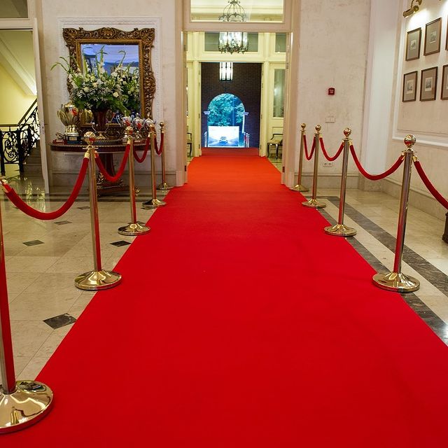 Red exhibition carpet laid along an event hallway