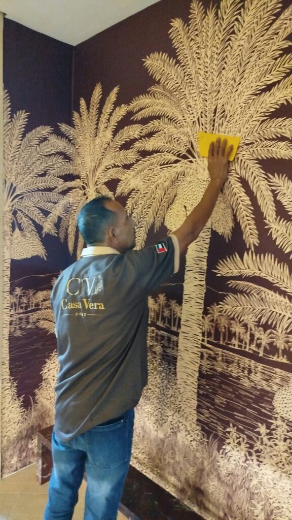 Gold palm tree wall mural installed in Dubai