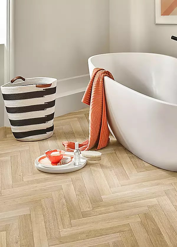 Herringbone vinyl plank flooring in a bathroom