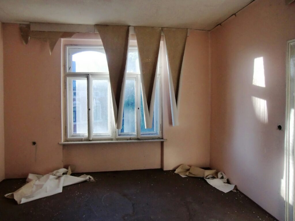 Old peeling wallpaper ready for removal